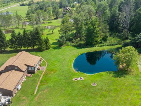 An image featuring water, plant, property, tree, nature, natural environment, natural landscape, land lot, biome, grassland at 6583 N Rome Rd.