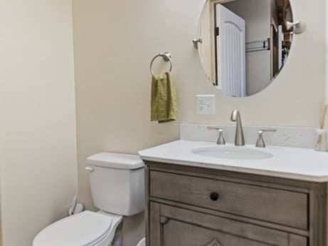 An image featuring mirror, bathroom cabinet, property, tap, cabinetry, sink, plumbing fixture, bathroom sink, purple, bathroom at 144 Milton Ln.