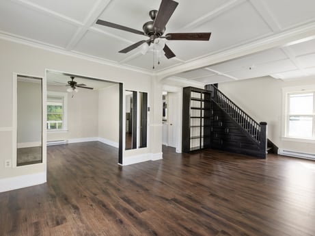 An image featuring ceiling fan, wood, window, interior design, hall, flooring, floor, laminate flooring, building, wood stain at 203 Harrison St.