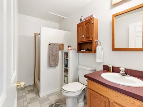 An image featuring mirror, bathroom cabinet, sink, tap, property, plumbing fixture, furniture, bathroom sink, cabinetry, bathroom at 105 Thomas St.