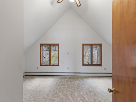 An image featuring window, building, fixture, wood, interior design, hall, floor, flooring, paint, ceiling at 815 Lakeside Dr.