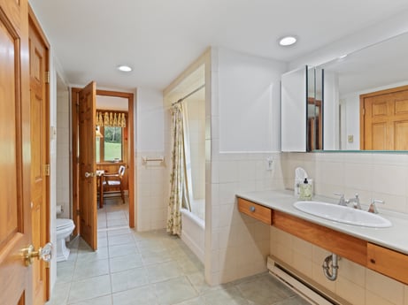 An image featuring mirror, bathroom cabinet, sink, building, tap, cabinetry, property, furniture, plumbing fixture, wood at 130 Haighs Pond Rd.