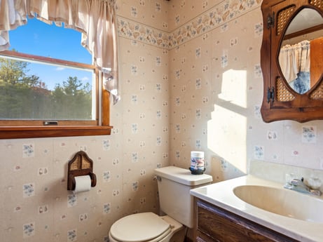 An image featuring brown, mirror, bathroom cabinet, property, sink, plumbing fixture, bathroom sink, tap, building, blue at 2266 Liberty Corners Rd.