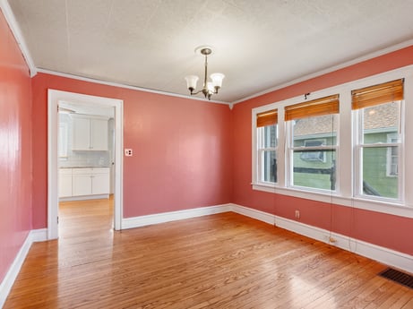 An image featuring property, window, fixture, hall, wood, lighting, interior design, paint, building, flooring at 132 Wilbur St.
