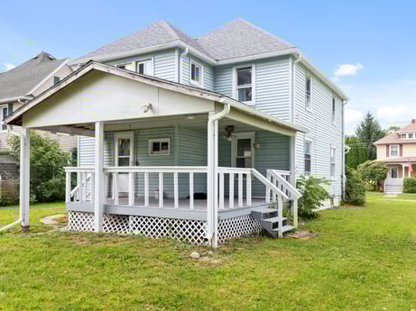 An image featuring sky, property, plant, window, building, house, porch, land lot, wood, siding at 203 Harrison St.