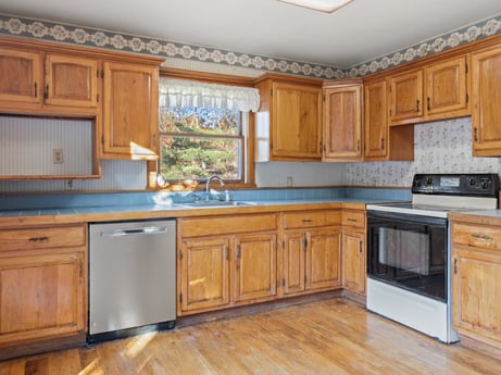 A kitchen at 2266 Liberty Corners Rd featuring: cabinetry, countertop, property, furniture, building, kitchen appliance, kitchen, wood, kitchen stove, home appliance