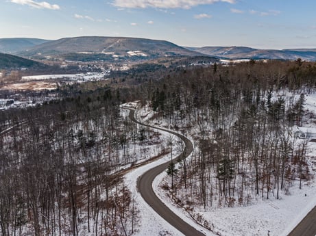 An image featuring sky, cloud, mountain, snow, slope, natural landscape, freezing, tree, terrain, landscape at Hemlock Hill Rd.