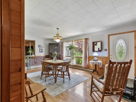 An image featuring table, furniture, plant, chair, picture frame, flowerpot, houseplant, wood, lighting, interior design at 1195 Twin Cuts Rd.
