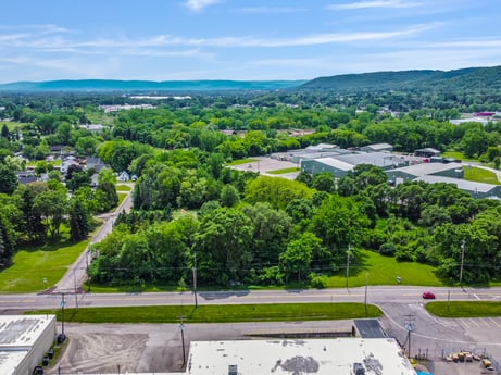 An image featuring sky, daytime, cloud, plant, tree, land lot, vegetation, urban design, residential area, grass at 1040 Center St.