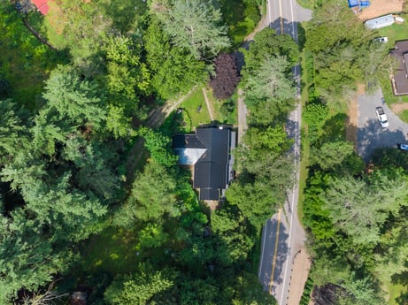 An image featuring plant community, plant, building, leaf, tree, slope, urban design, landscape, shrub, groundcover at 9224 PA-87.