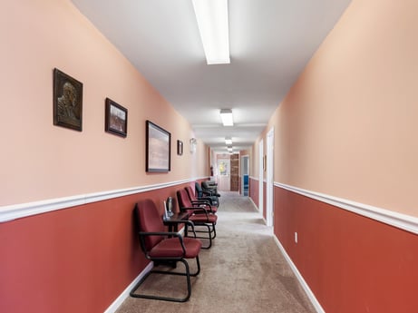An image featuring picture frame, chair, building, interior design, floor, flooring, hall, ceiling, fixture, bookcase at 213 Main St.