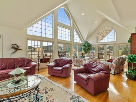 An image featuring couch, furniture, table, picture frame, building, houseplant, living room, interior design, purple, lighting at 218 Point Rd.