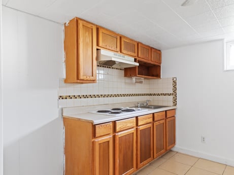 An image featuring cabinetry, furniture, building, property, countertop, wood, kitchen appliance, drawer, interior design, flooring at 203 Harrison St.