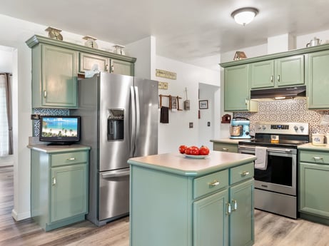 A kitchen at 105 Thomas St featuring: cabinetry, property, furniture, countertop, kitchen appliance, kitchen stove, home appliance, kitchen, interior design, drawer