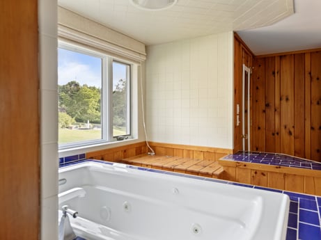 An image featuring bathtub, property, fixture, window, wood, architecture, bathroom, interior design, floor, building at 130 Haighs Pond Rd.