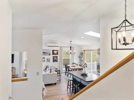 An image featuring picture frame, table, wood, interior design, door, floor, flooring, hall, couch, chair at 18 Country View Dr.