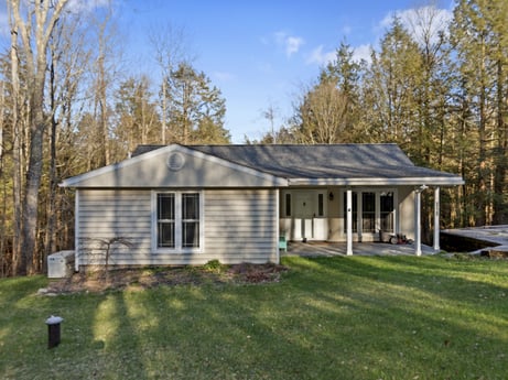 An image featuring sky, cloud, building, plant, property, house, window, tree, land lot, wood at 1061 Muncy St.