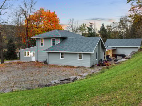 An image featuring sky, plant, window, building, tree, cloud, natural landscape, house, wood, land lot at 17899 US-6.