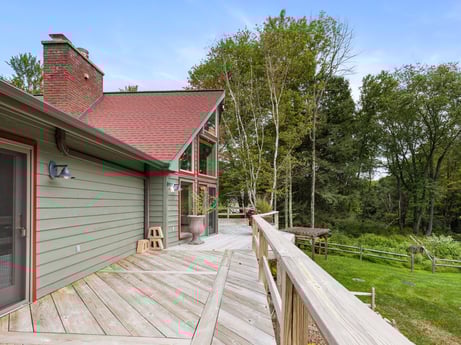 An image featuring sky, plant, tree, wood, land lot, building, cottage, landscape, rural area, siding at 276 Mountain View Ln.