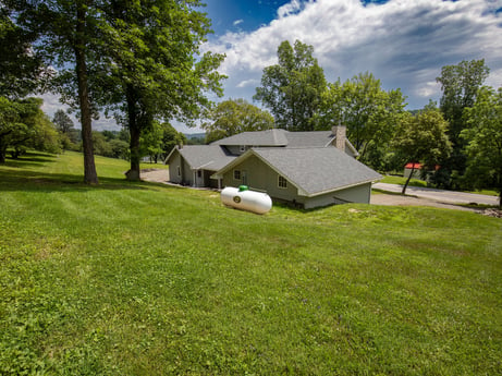 An image featuring cloud, sky, plant, tree, green, natural landscape, house, land lot, shade, cottage at 17899 US-6.