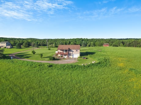 An image featuring sky, cloud, plant, natural landscape, tree, house, window, grass, building, landscape at 85 View Rd.