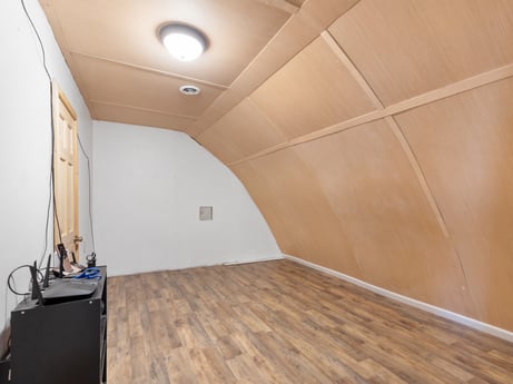 An image featuring building, wood, house, flooring, floor, hall, hardwood, wood stain, laminate flooring, ceiling at 302 N Keystone Ave.