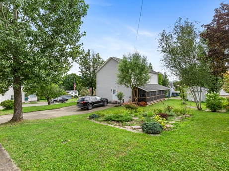 An image featuring plant, sky, cloud, building, tree, wheel, house, land lot, tire, vehicle at 105 Thomas St.