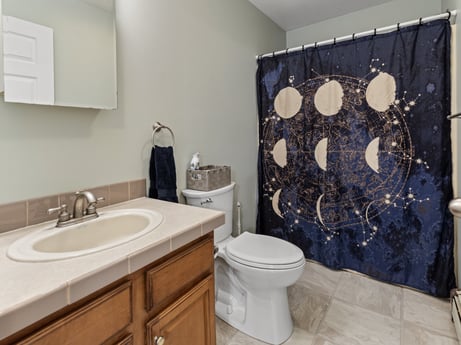 An image featuring bathroom cabinet, sink, plumbing fixture, property, mirror, tap, purple, bathroom sink, cabinetry, wood at 1841 Lynch Rd.