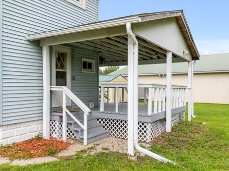 An image featuring plant, building, sky, window, stairs, porch, house, door, wood, land lot at 203 Harrison St.