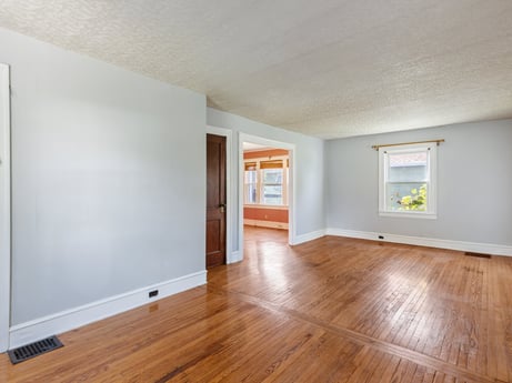 An image featuring wood, paint, fixture, flooring, wood stain, hall, floor, laminate flooring, wall, hardwood at 132 Wilbur St.