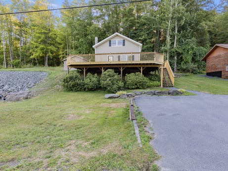 An image featuring plant, sky, building, tree, window, land lot, natural landscape, house, biome, grass at 127 Shore Dr.