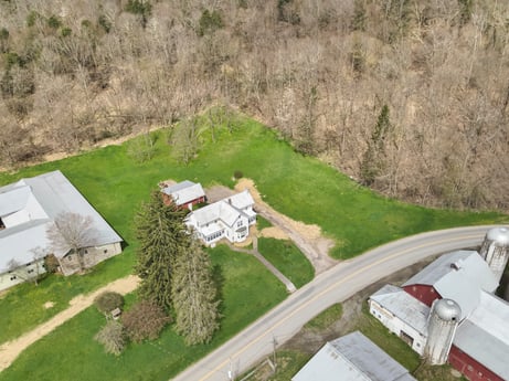 An image featuring plant, building, land lot, urban design, grass, slope, landscape, groundcover, roof, house at 525 Spring Hill Rd.