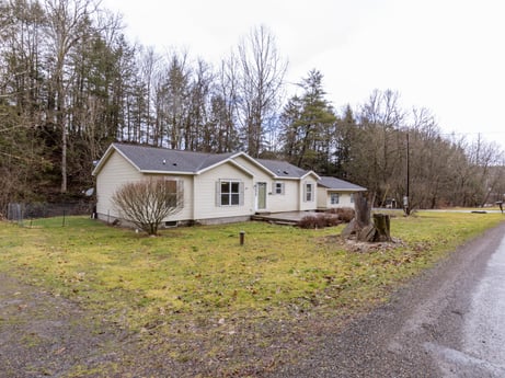 An image featuring plant, building, sky, window, house, tree, natural landscape, cloud, land lot, wood at 1841 Lynch Rd.
