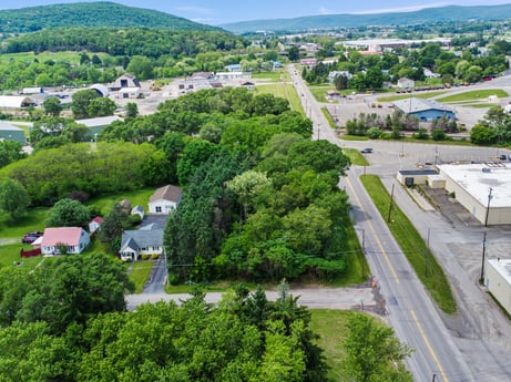 An image featuring plant, sky, tree, land lot, urban design, public space, grass, landscape, real estate, city at 1040 Center St.