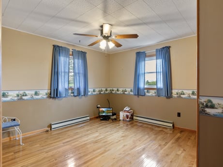 An image featuring window, ceiling fan, window blind, wood, lighting, interior design, fixture, building, shade, living room at 1195 Twin Cuts Rd.