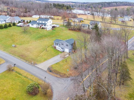 An image featuring plant, building, ecoregion, land lot, house, window, tree, grass, landscape, residential area at 18 Country View Dr.