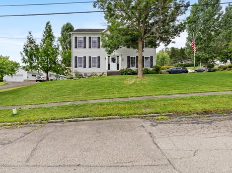 An image featuring plant, sky, building, tree, road surface, land lot, asphalt, urban design, window, grass at 105 Thomas St.