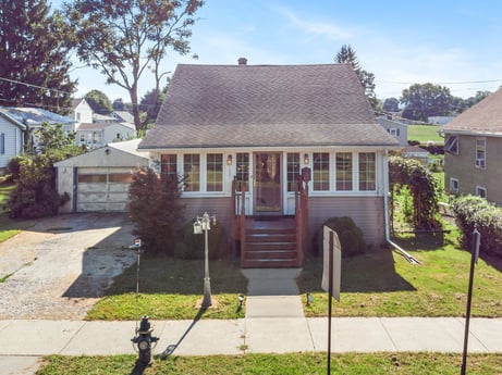 An image featuring plant, sky, window, building, tree, land lot, door, grass, cottage, house at 132 Wilbur St.