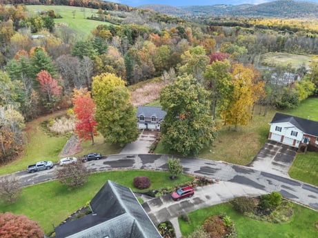 An image featuring plant, property, infrastructure, car, tree, land lot, urban design, biome, grass, neighbourhood at 74 Susquehannock Trail.