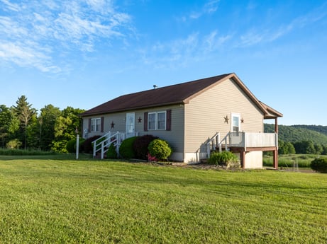 An image featuring sky, plant, cloud, building, window, tree, natural landscape, house, land lot, wood at 85 View Rd.