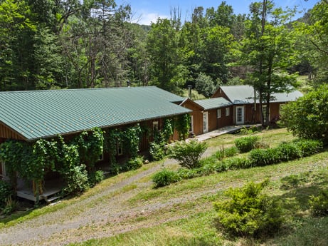 An image featuring plant, property, plant community, window, sky, building, nature, natural landscape, tree, land lot at 154 Fox Run Rd.