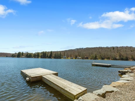 An image featuring water, sky, cloud, water resources, plant, natural landscape, tree, wood, lake, bank at 144 Milton Ln.