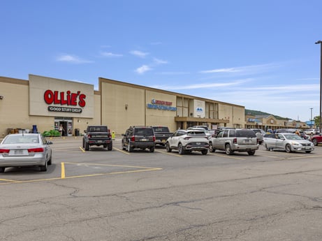 An image featuring car, automotive parking light, wheel, sky, tire, cloud, land vehicle, vehicle, motor vehicle, building at 1040 Center St.