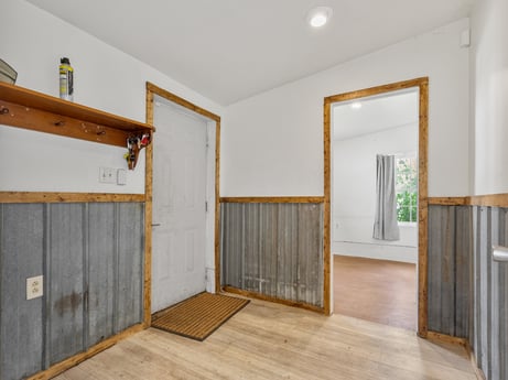 An image featuring building, fixture, wood, house, interior design, flooring, floor, wood stain, hall, hardwood at 5442 Clarkstown Rd.