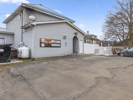 An image featuring sky, cloud, wheel, building, motor vehicle, tree, asphalt, road surface, land lot, vehicle at 199 State St.