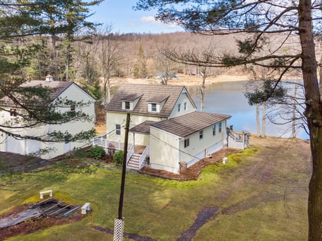 An image featuring plant, property, building, window, water, sky, tree, natural landscape, house, land lot at 199 S Lake Rd.