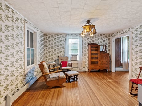 An image featuring furniture, wood, window, building, interior design, flooring, floor, living room, beam, wood stain at 2399 Keene Summit Rd.