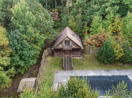 An image featuring plant, tree, natural landscape, building, cottage, wood, groundcover, grass, shrub, landscape at 121 Marcy Rd.