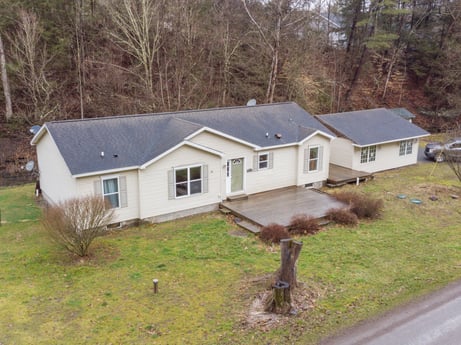 An image featuring plant, building, window, house, land lot, tree, grass, wood, cottage, siding at 1841 Lynch Rd.