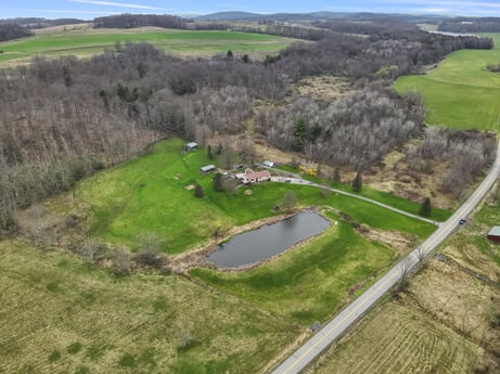 An image featuring water resources, ecoregion, natural landscape, natural environment, plant, sky, tree, land lot, water, urban design at 1569 S Macafee Rd.